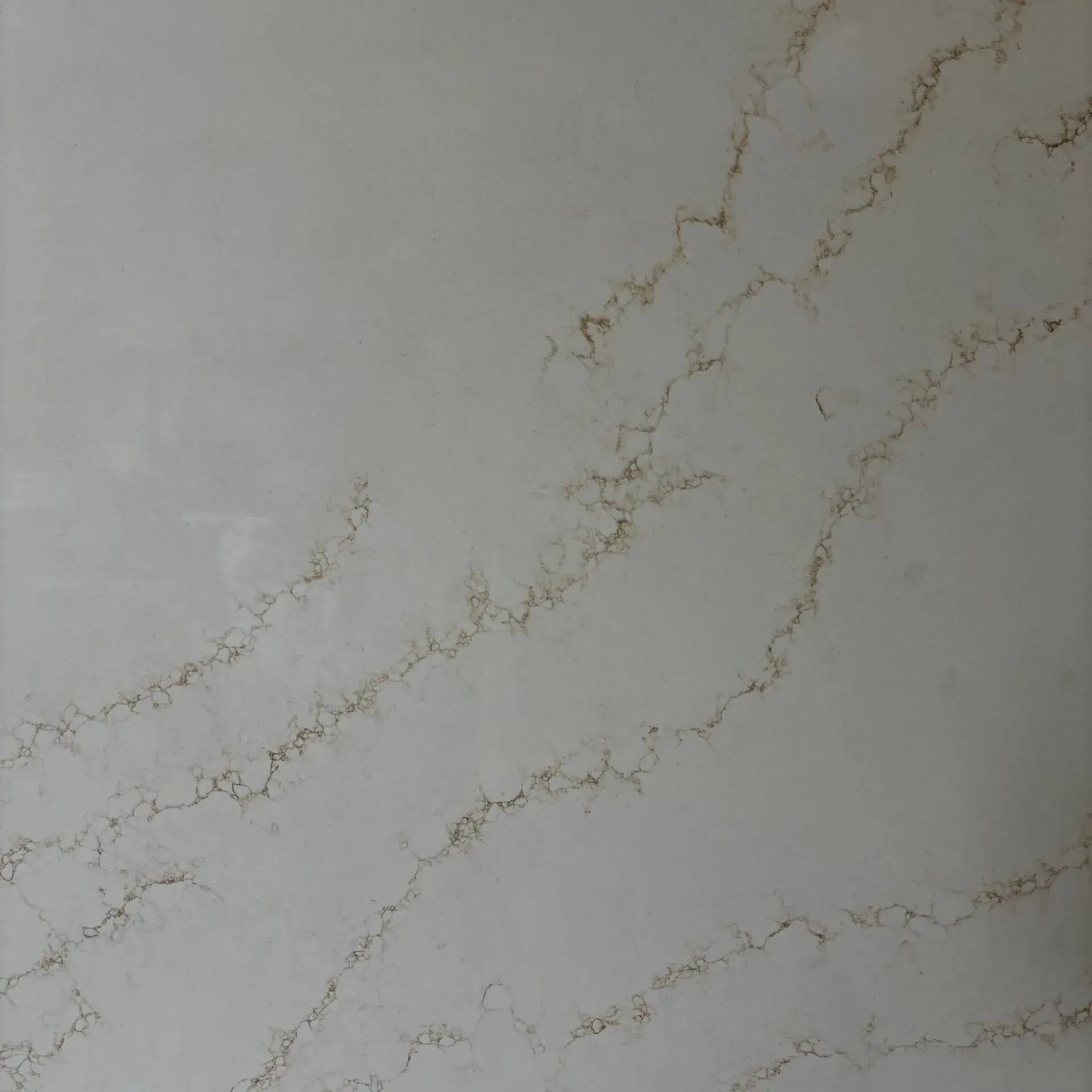 Light gray marble surface with subtle gold veining.