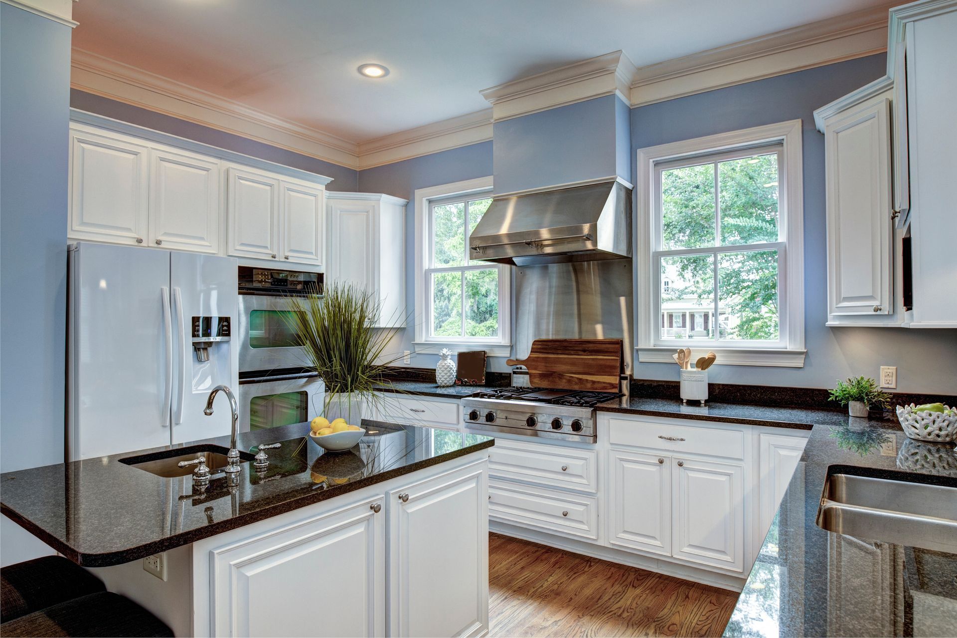 A bright, elegant kitchen with off-white cabinets