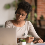 woman looking at laptop