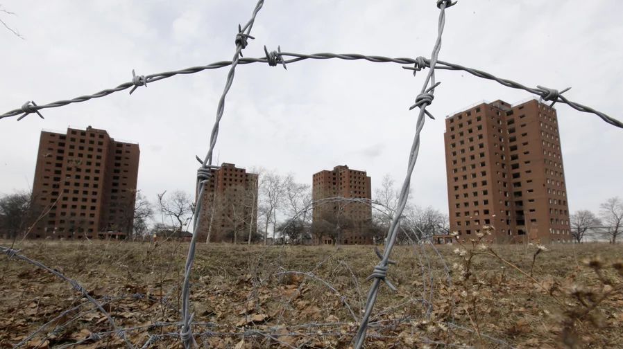 Photo of abandoned buildings and barbed wire