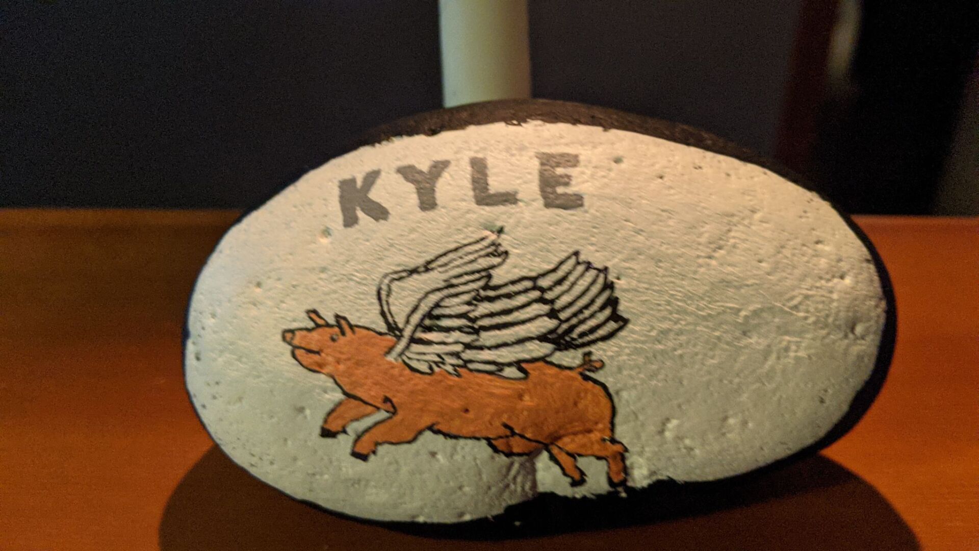 painted rock and candle