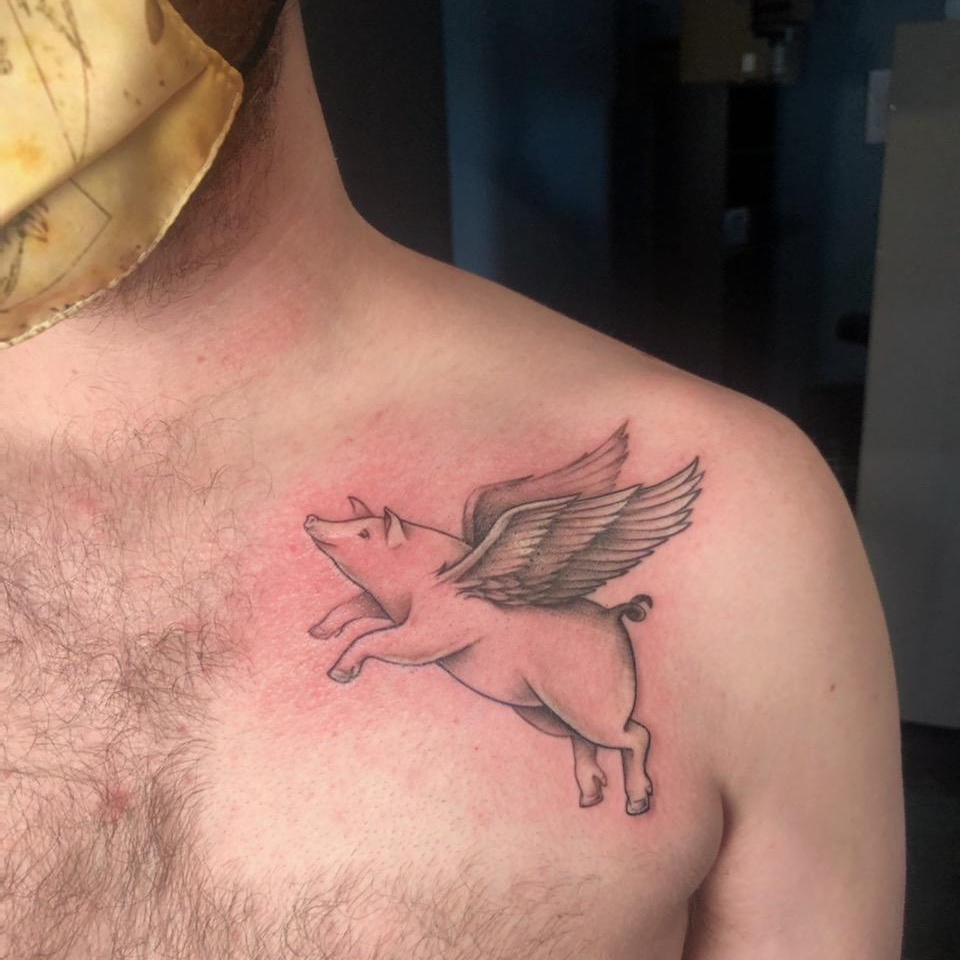 Scott's flying pig tattoo