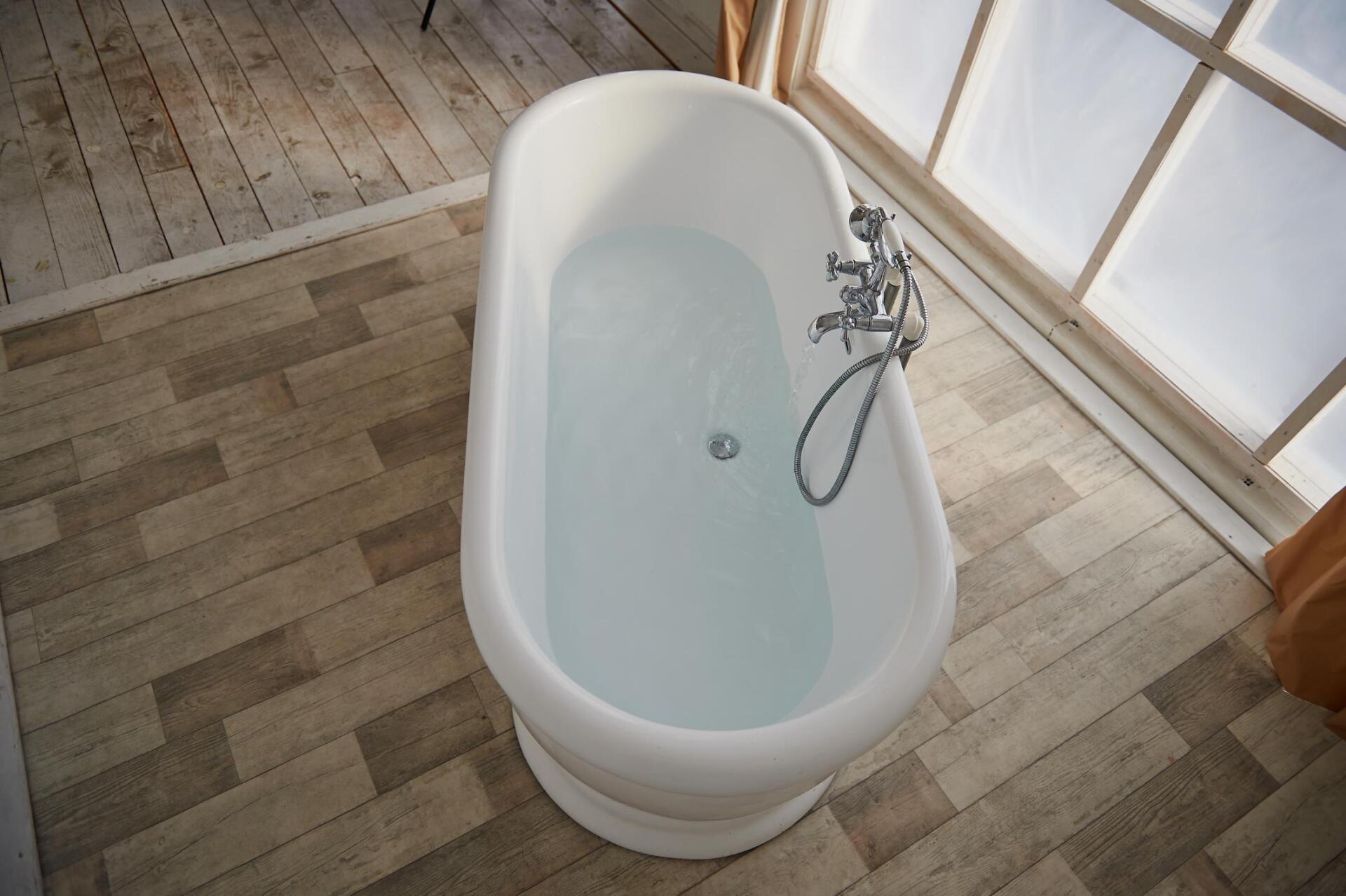 bathroom with wood flooring