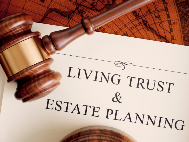 Judge’s gavel beside “Living Trust & Estate Planning” text on a document with a map background