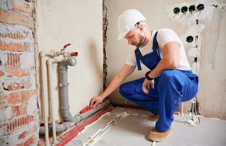 Man Measuring the Pipes — Ponte Vedra Beach, FL — Van Worz Plumbing Inc.