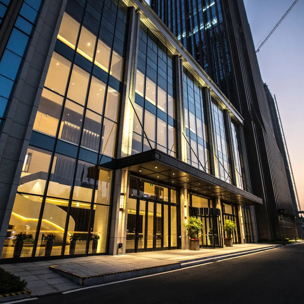 OE Services - A very tall building with a lot of windows