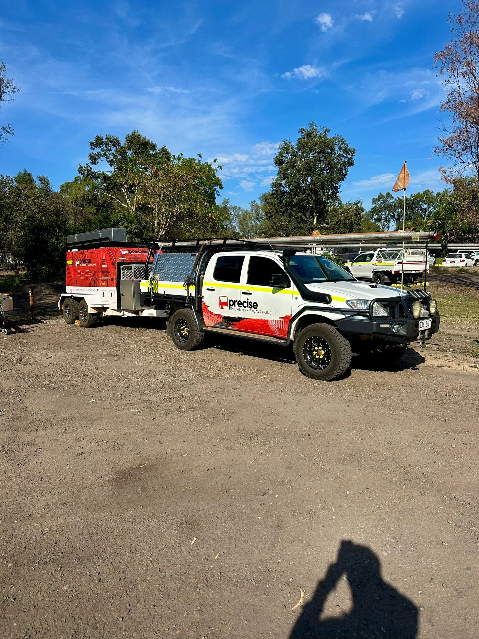 A person is using a drain snake to unblock a sink — Precise Plumbing & Excavations Pty Ltd in Collinsville, QLD