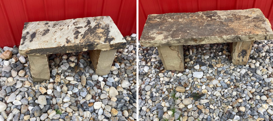 Two small weathered concrete benches on gravel, in front of a red wall