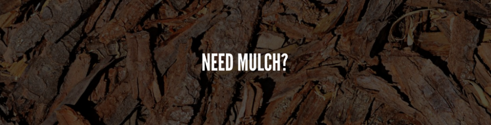 Text reading “NEED MULCH?” over a close-up of dark brown mulch pieces