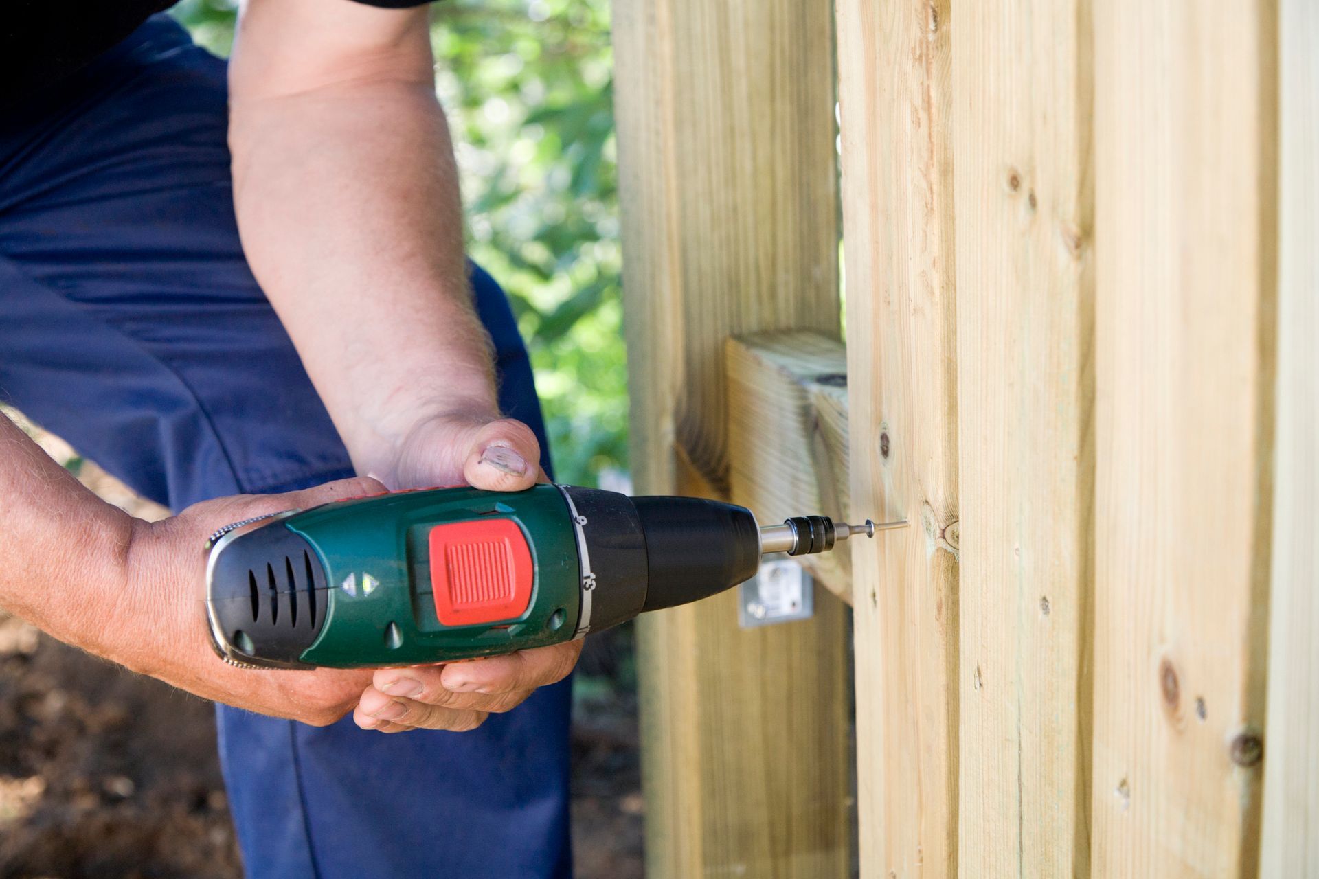 Drilling a screw into wood