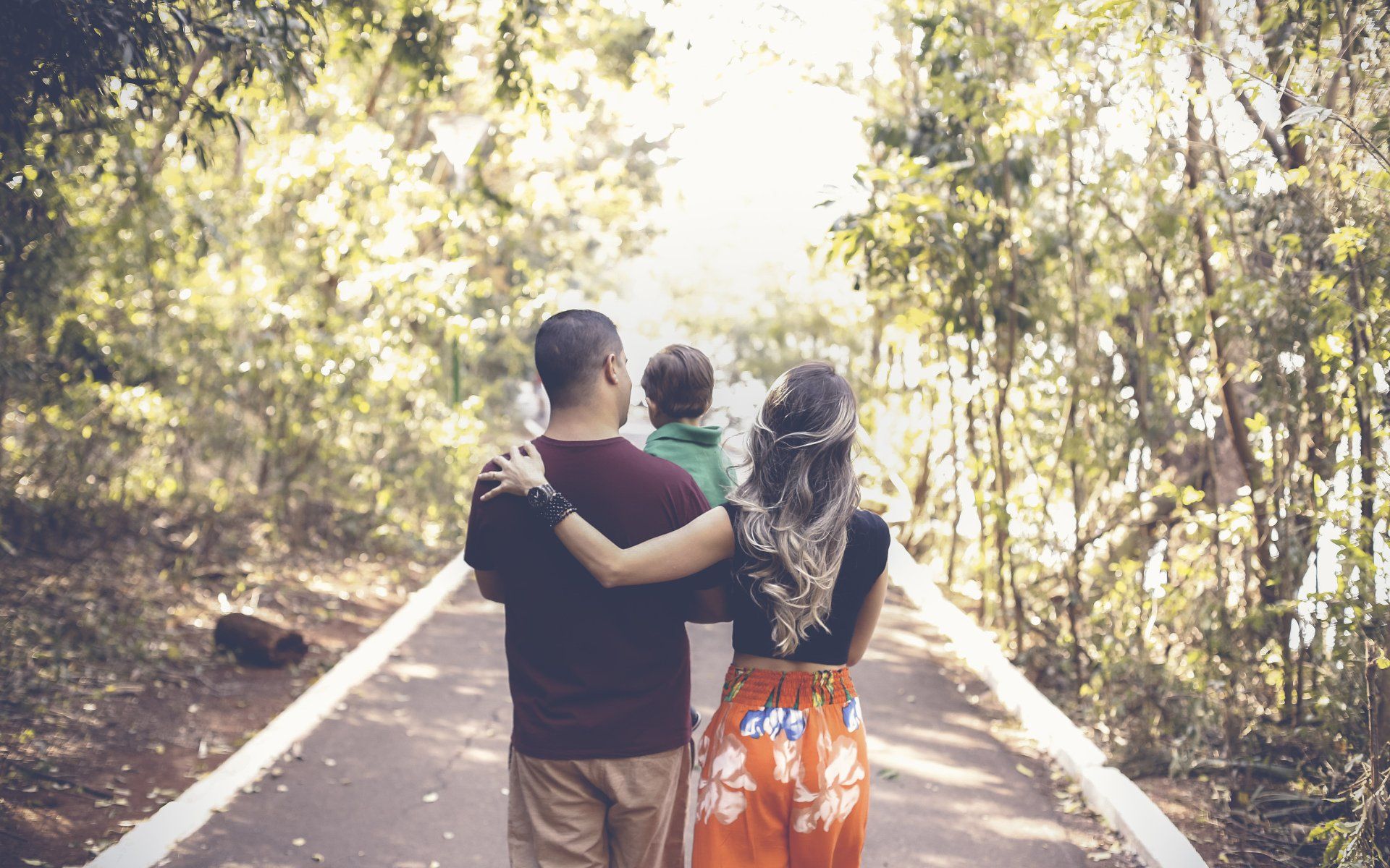 couple walking with child