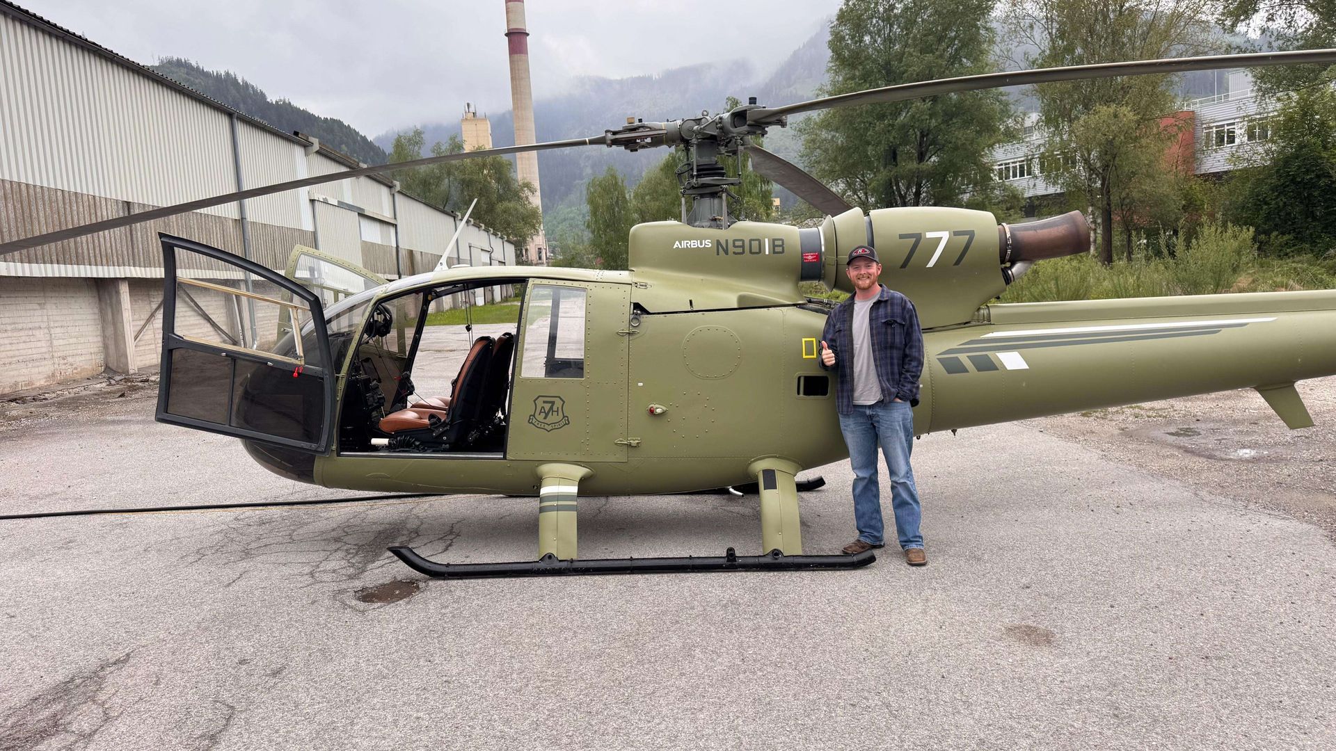 Mitchell Hynes in front of an SA342 Gazelle