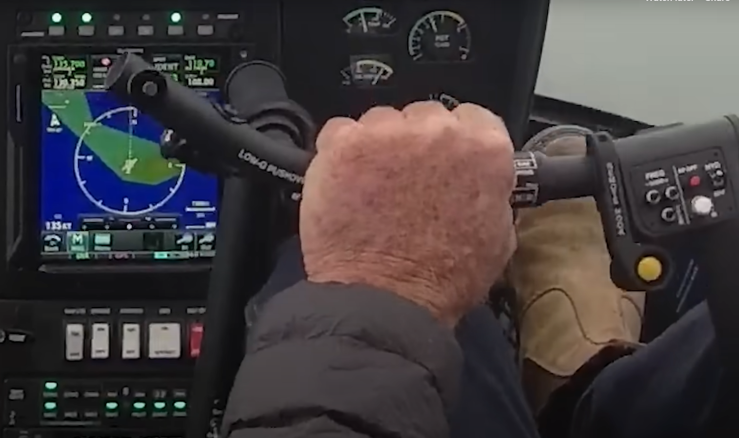 View of the pilot's hand on the cyclic