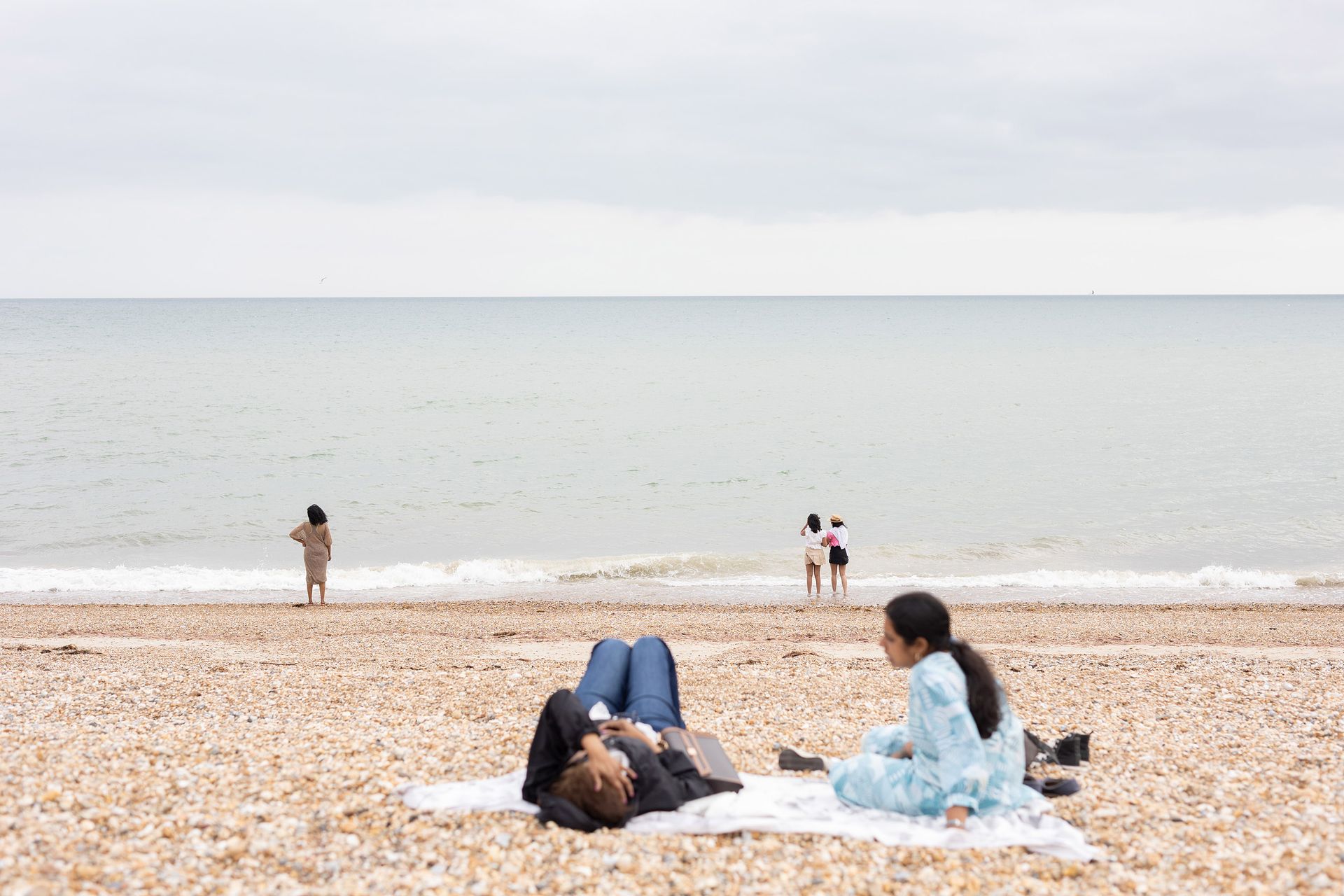 A view from the pier of Bognor Regis beach at low tide., across the shingle  to the  Esplanade.