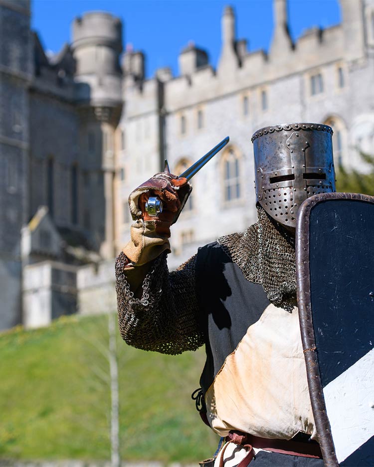 A knight in full armour during a re-enactment event in the grounds of Arundel Castle A knight in full armour during a re-enactment eventin the grounds of Arundel Castle