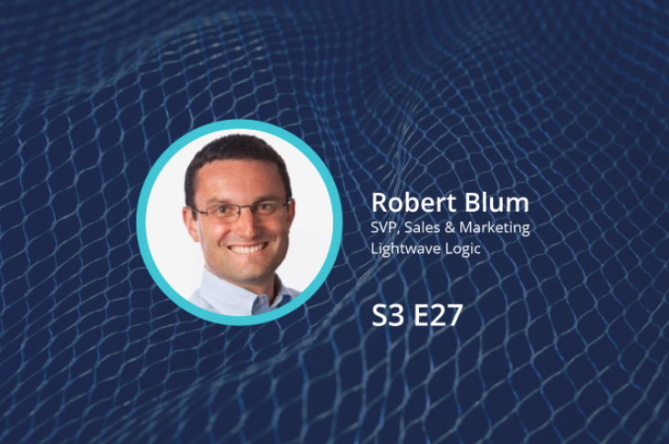 Photo of Lightwave Logic’s Robert Blum on a blue background