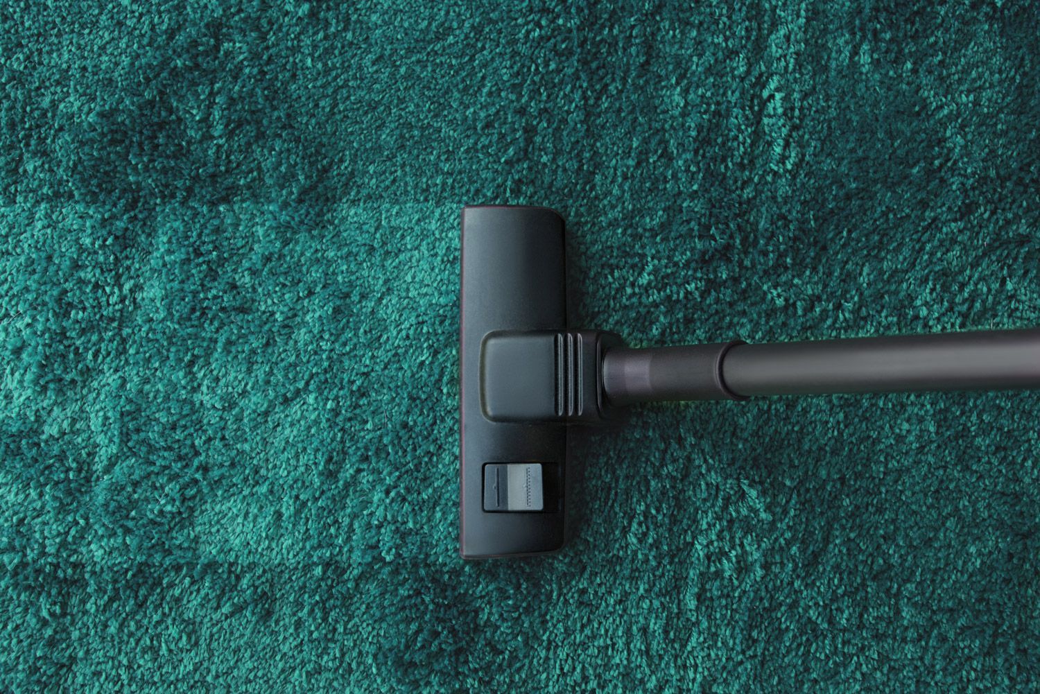Vacuum cleaner on carpet showing professional carpet cleaning service in Brisbane