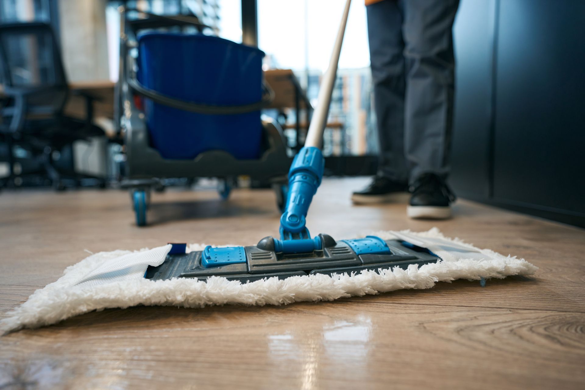 Cleaner vacuuming carpet in home during professional house cleaning service in Brisbane