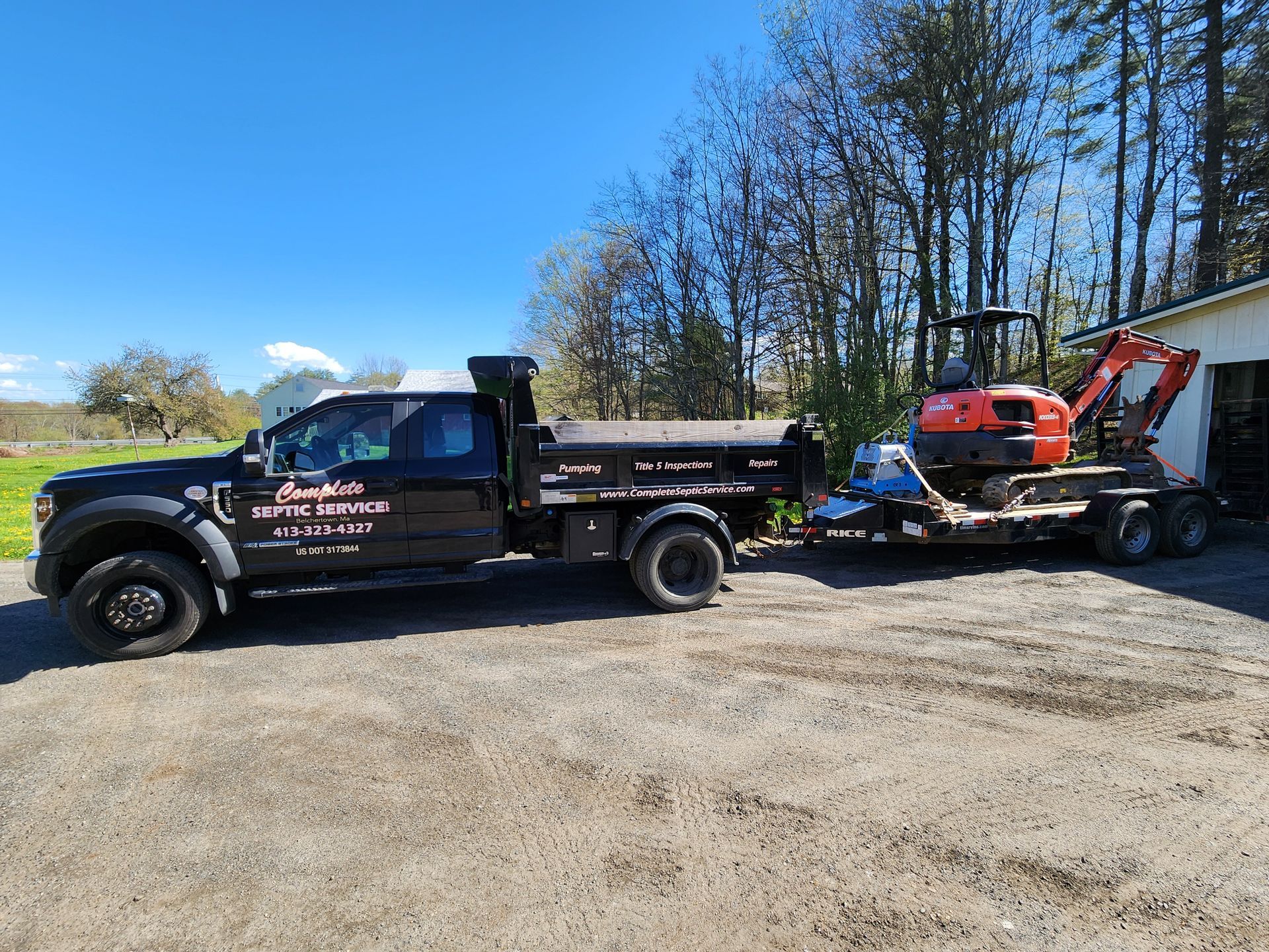 Complete Septic Service trucks pulling up to install a new septic system in Palmer, MA