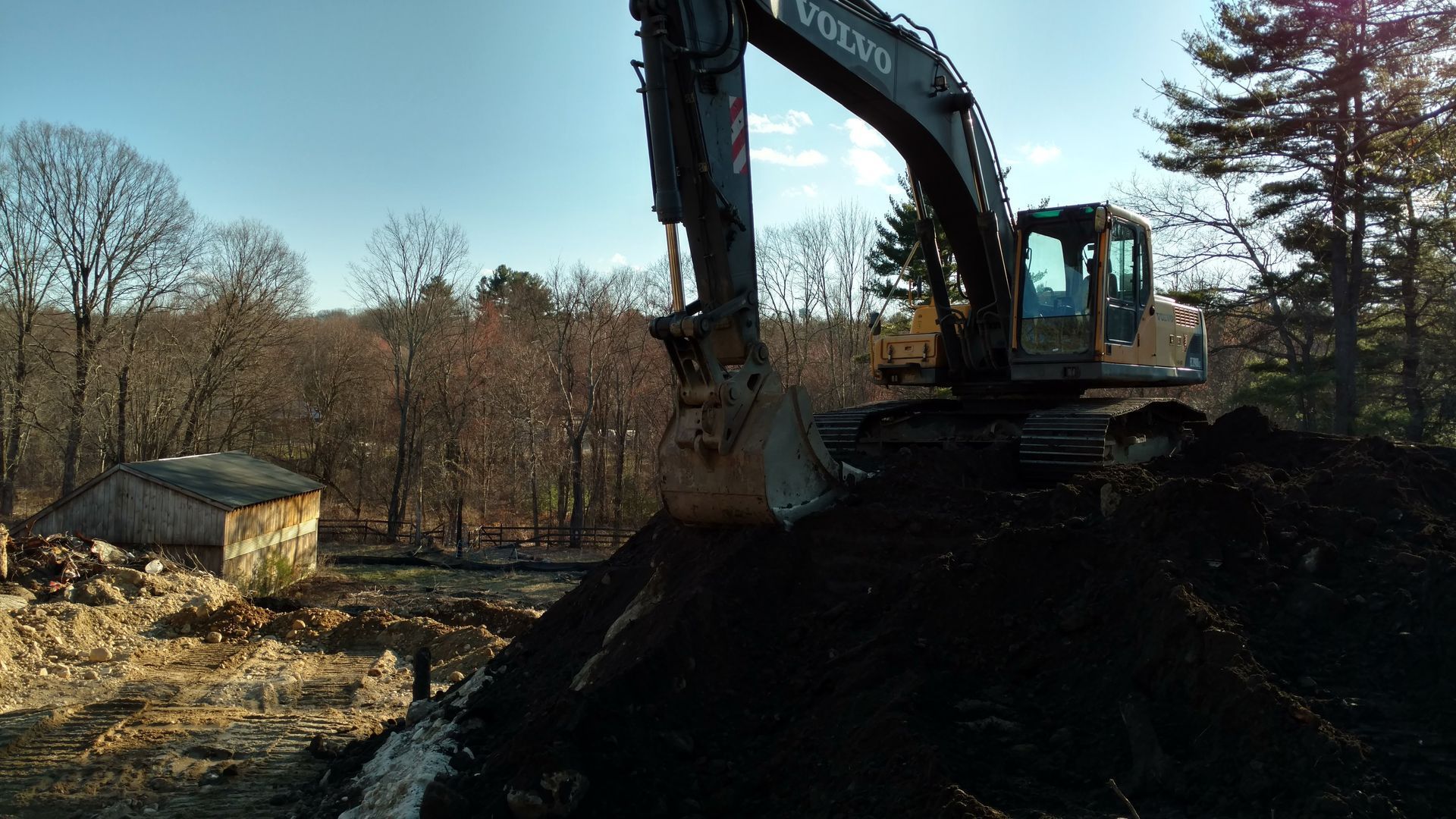 Excavating to install a new septic system in South Hadley, MA