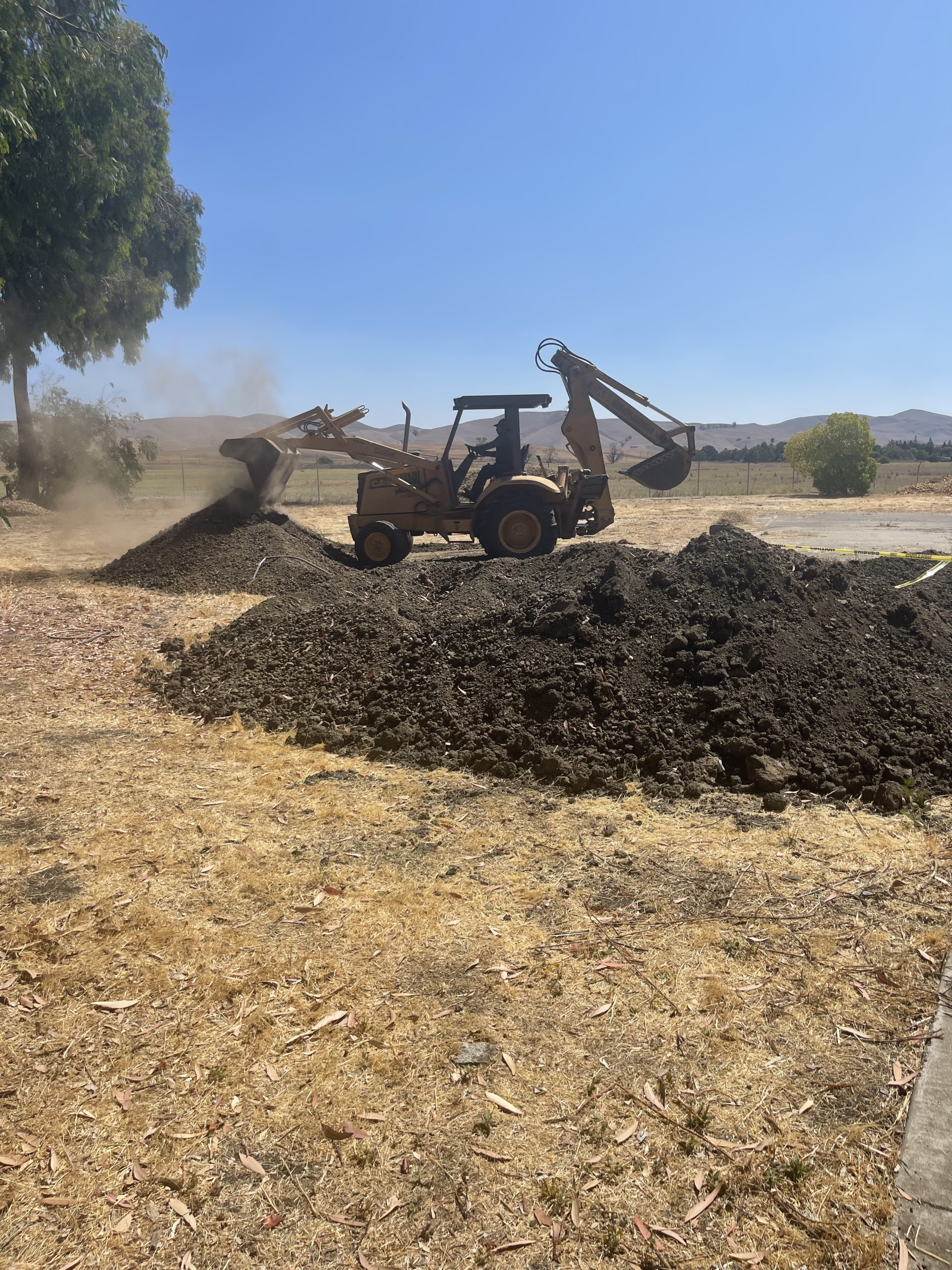 Timberland Tree Care equipment moving dirt
