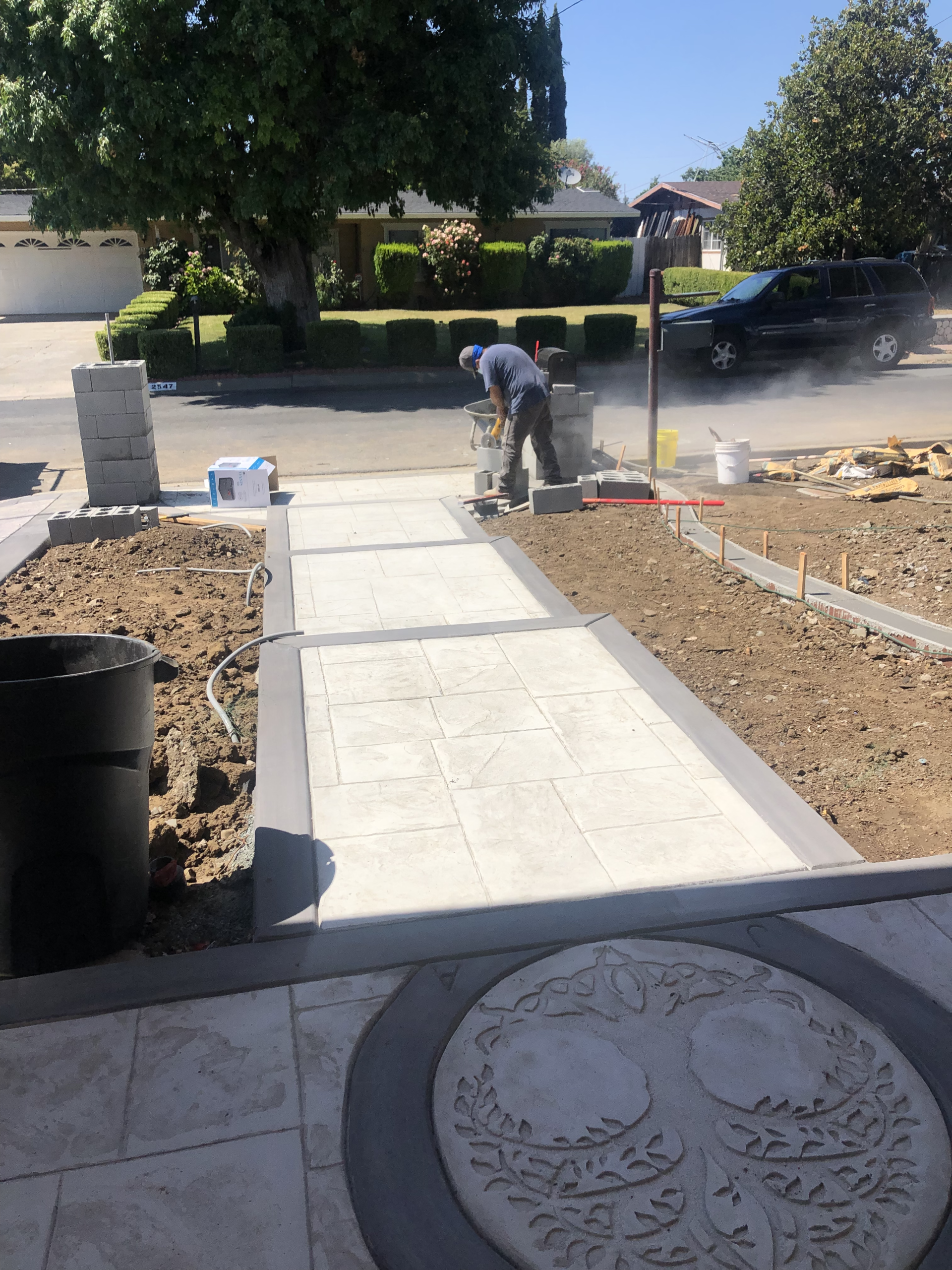Timberland Tree Care installing a decorative concrete walkway and entryway