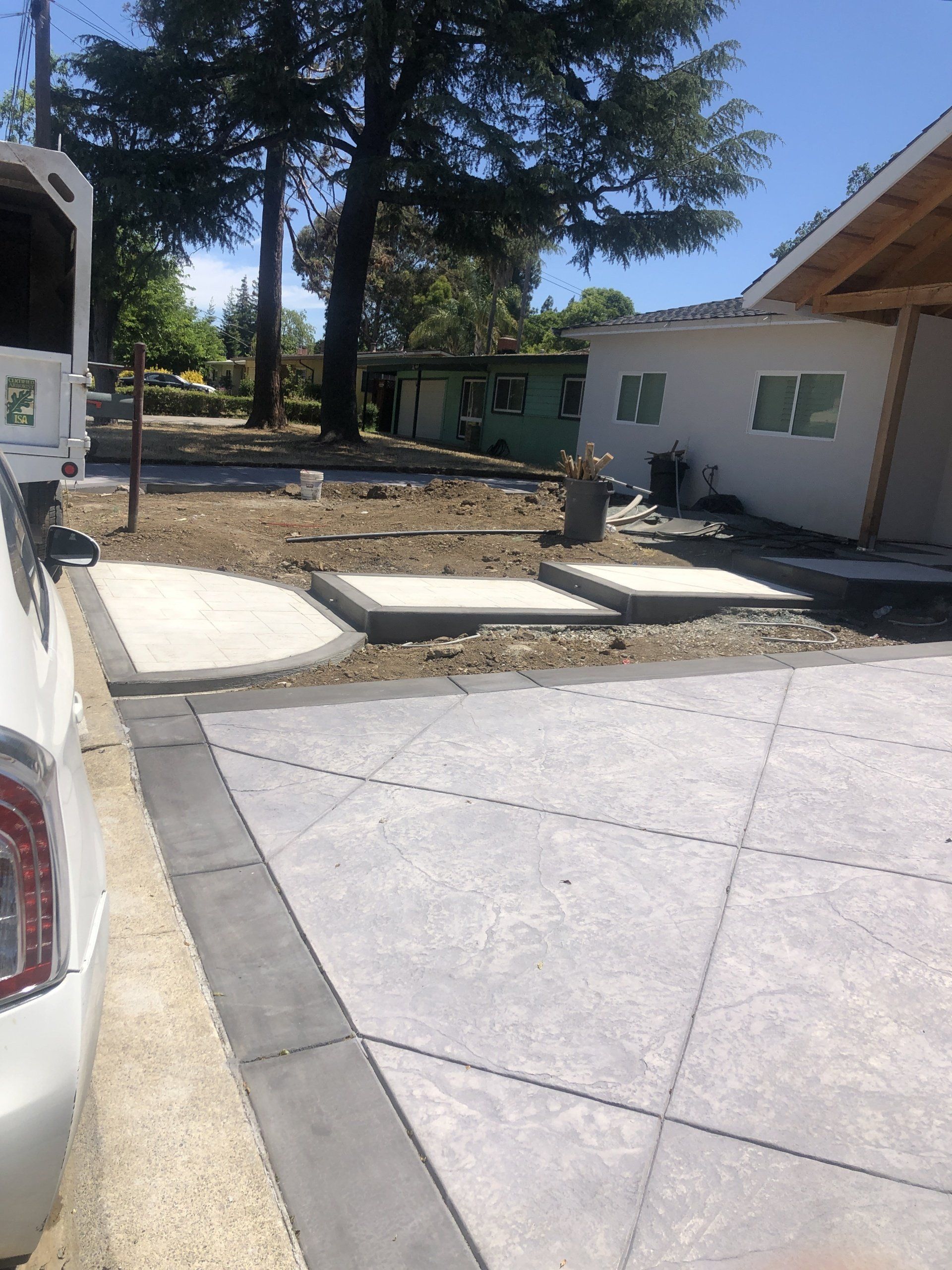 Timberland Tree Care workers installing decorative pavers