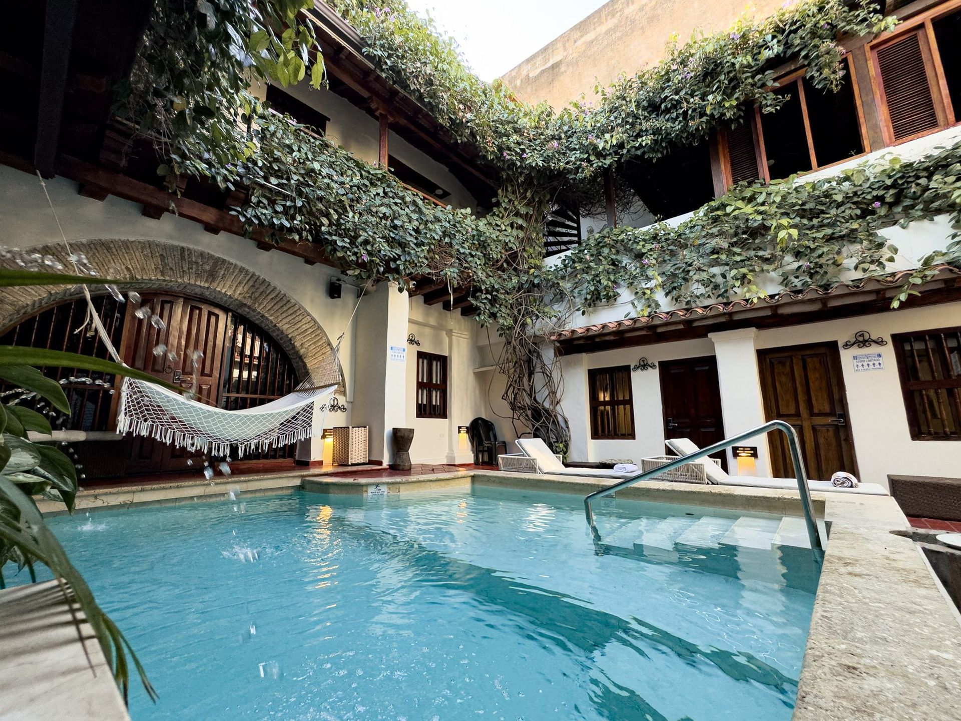 Pool with climbing plants at Casa Bugó, Cartagena Old City