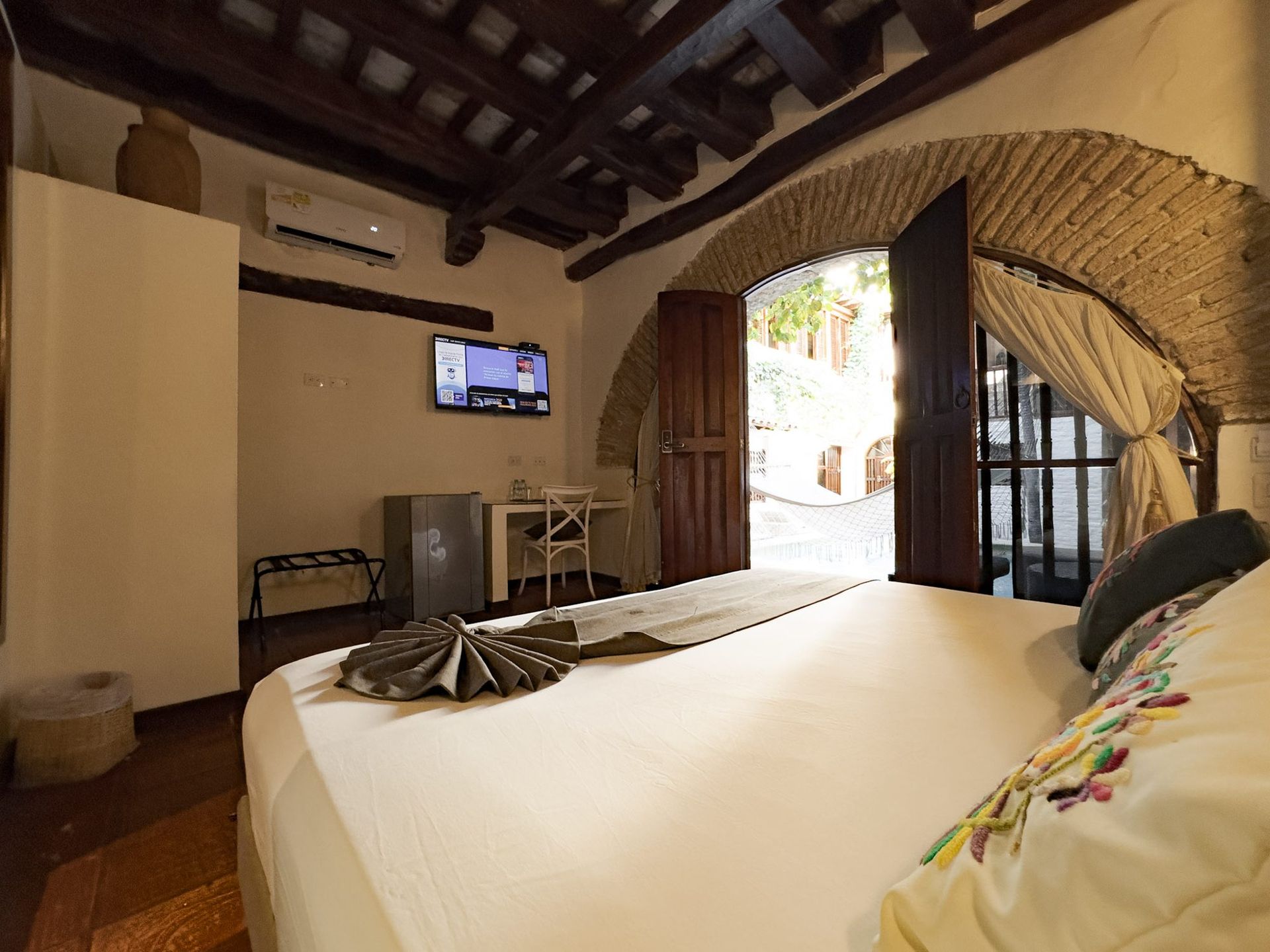 Room with colonial arch at Casa Bugó, Cartagena Old City