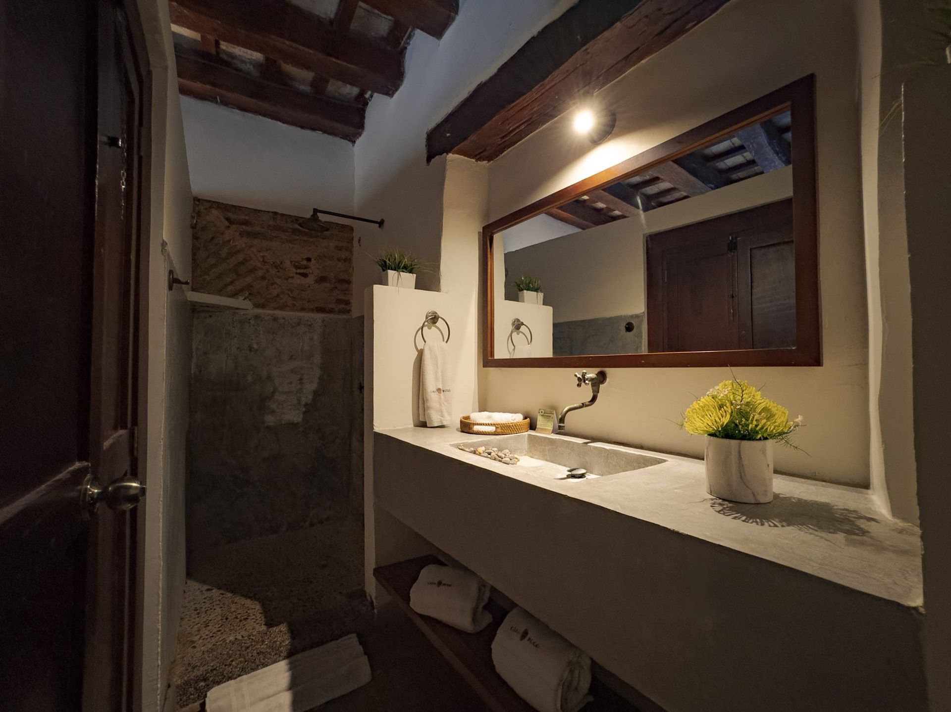 Bathroom mirror and vanity at Casa Bugó, Cartagena