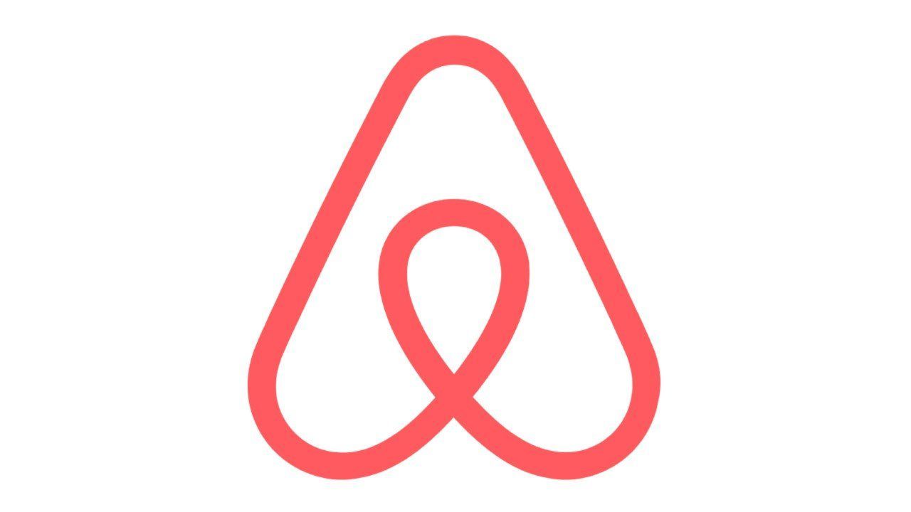 Pink Airbnb logo: stylized