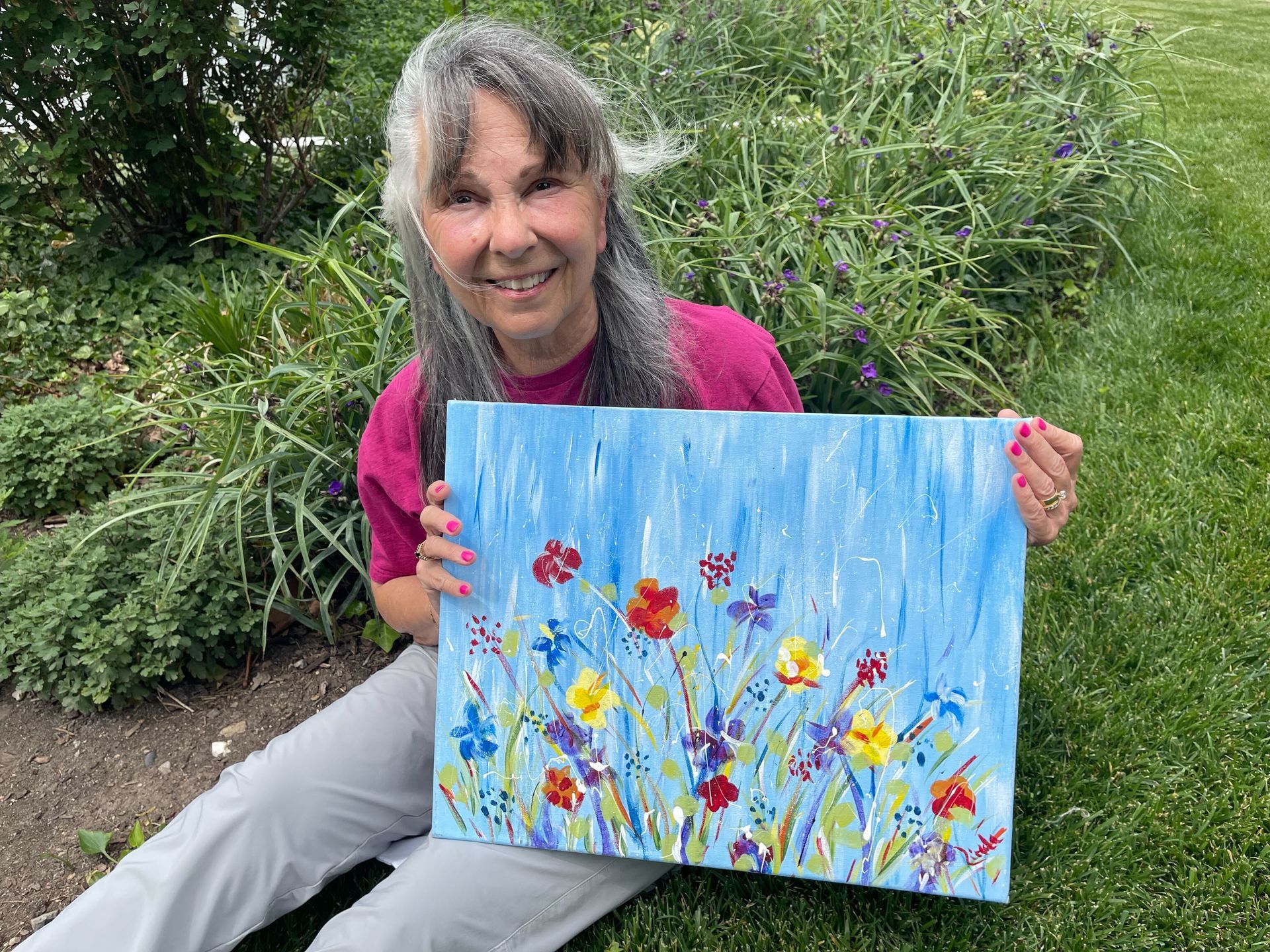 Linda Pearson with an acrylic painting. Linda will lead the 2026 Coffee & Canvas Workshop