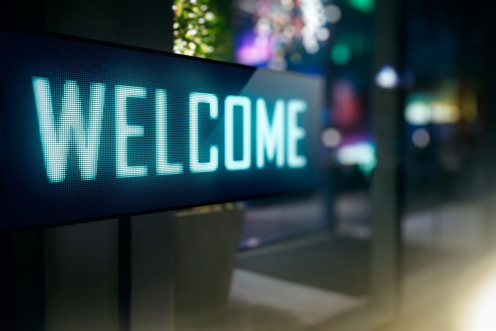 A Welcome Sign is Lit Up in the Dark — Cairns Synergy Electrical in Manunda, QLD