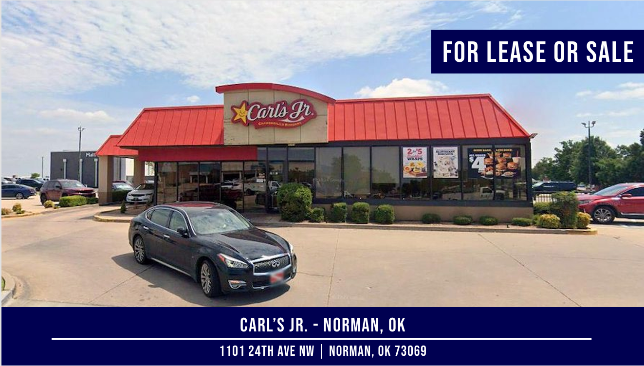 Carl's Jr. restaurant in Norman, OK, with a car parked in front. Red roof, 