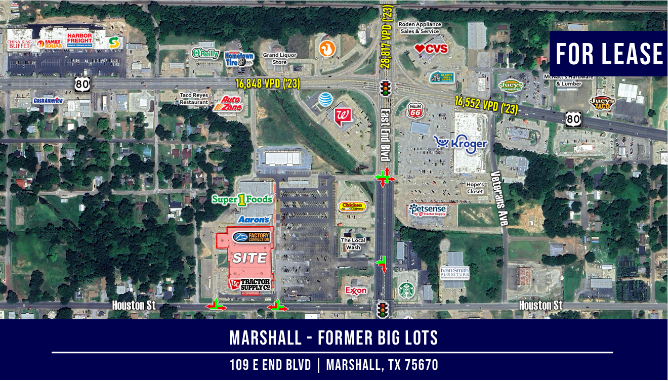 Aerial view of Marshall, TX, featuring businesses on a street. 