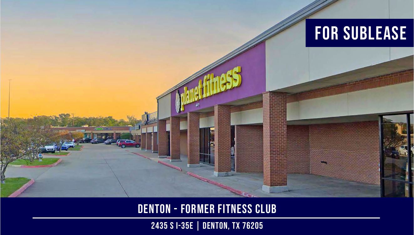 Exterior of former Planet Fitness building in Denton, TX, available for sublease. Purple and yellow sign.
