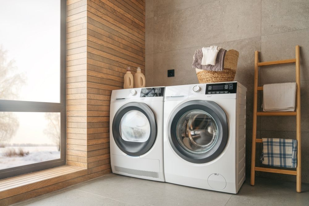 Two White Laundry Machines Placed Side-by-side in a Modern Laundry Room — Eurocoast Appliance Service In Woy Woy, NSW