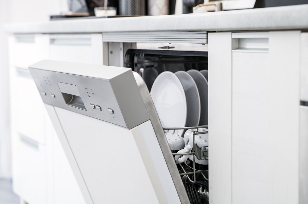 Partially Open, Modern White Dishwasher — Eurocoast Appliance Service In Gosford, NSW