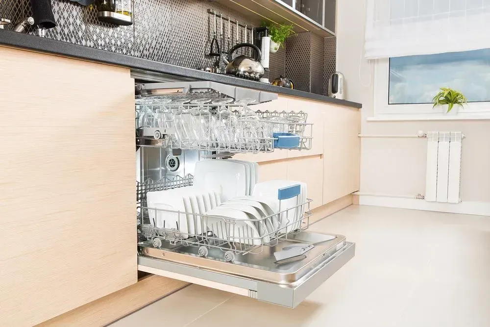 Modern Kitchen With a Dishwasher Door Open — Eurocoast Appliance Service In Gosford, NSW