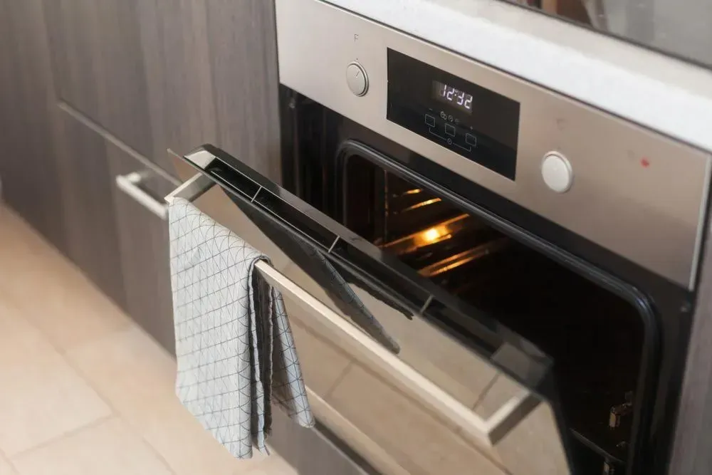 Stainless Steel Oven With Its Door Partially Open — Eurocoast Appliance Service In Gosford, NSW