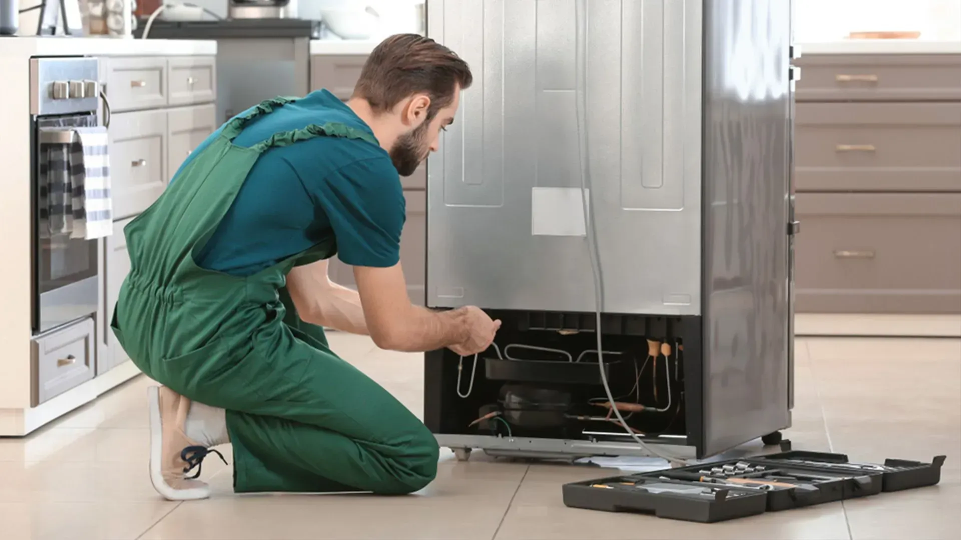 Person Repair the Back of a Refrigerator — Eurocoast Appliance Service In Gosford, NSW