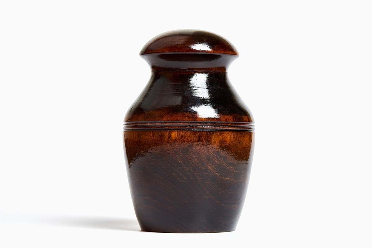 Wooden, urn-shaped container with a glossy, dark finish.