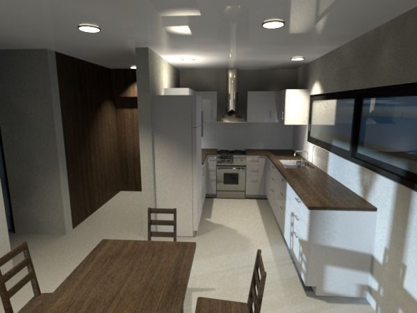 Cocina moderna con gabinetes blancos, encimeras de madera oscura, mesa de comedor y electrodomésticos de acero inoxidable.