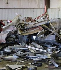 Pile of twisted scrap metal and debris in an industrial area