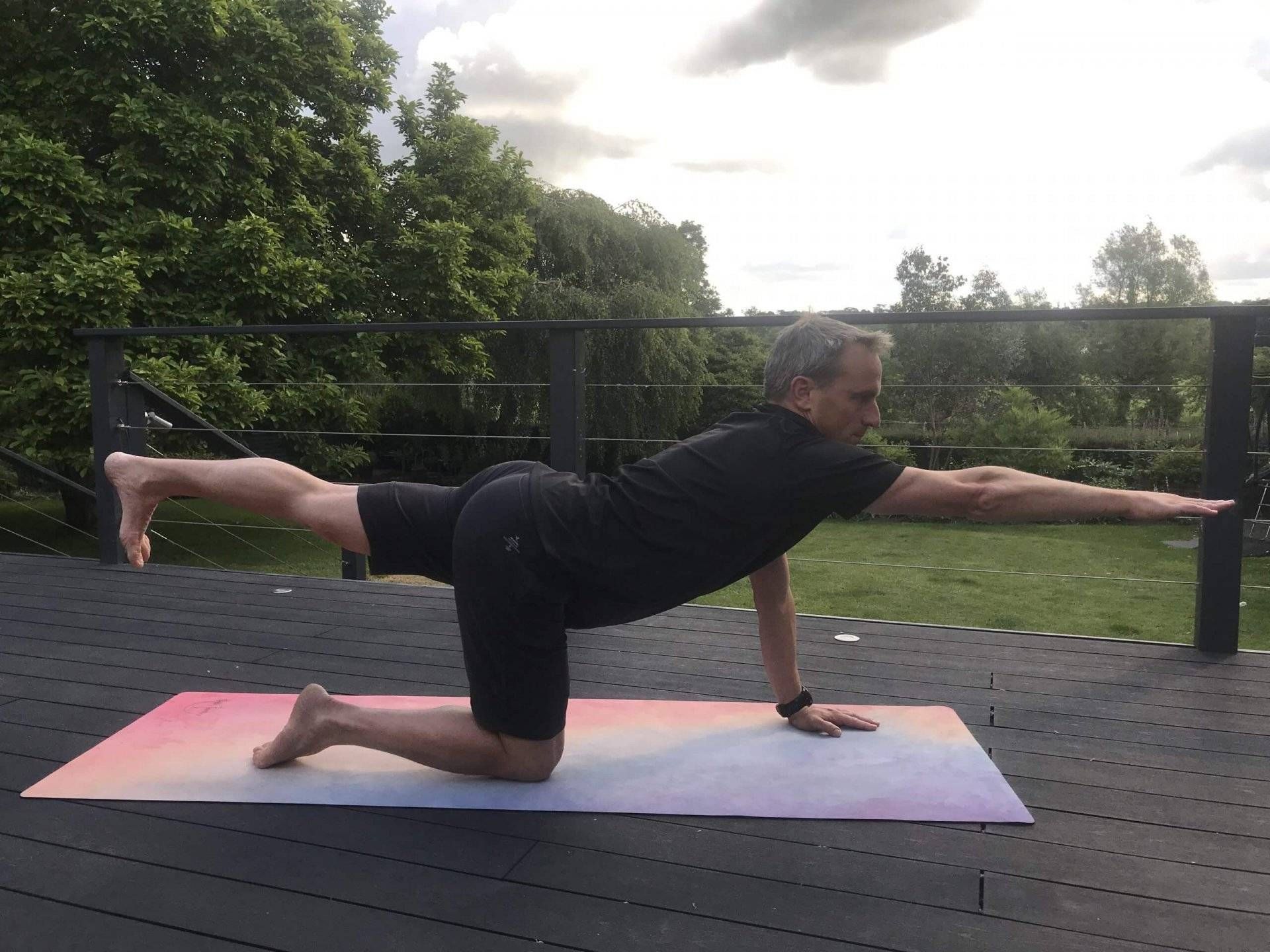 Bird dog pose. Back pain relief. Yoga in Cookham