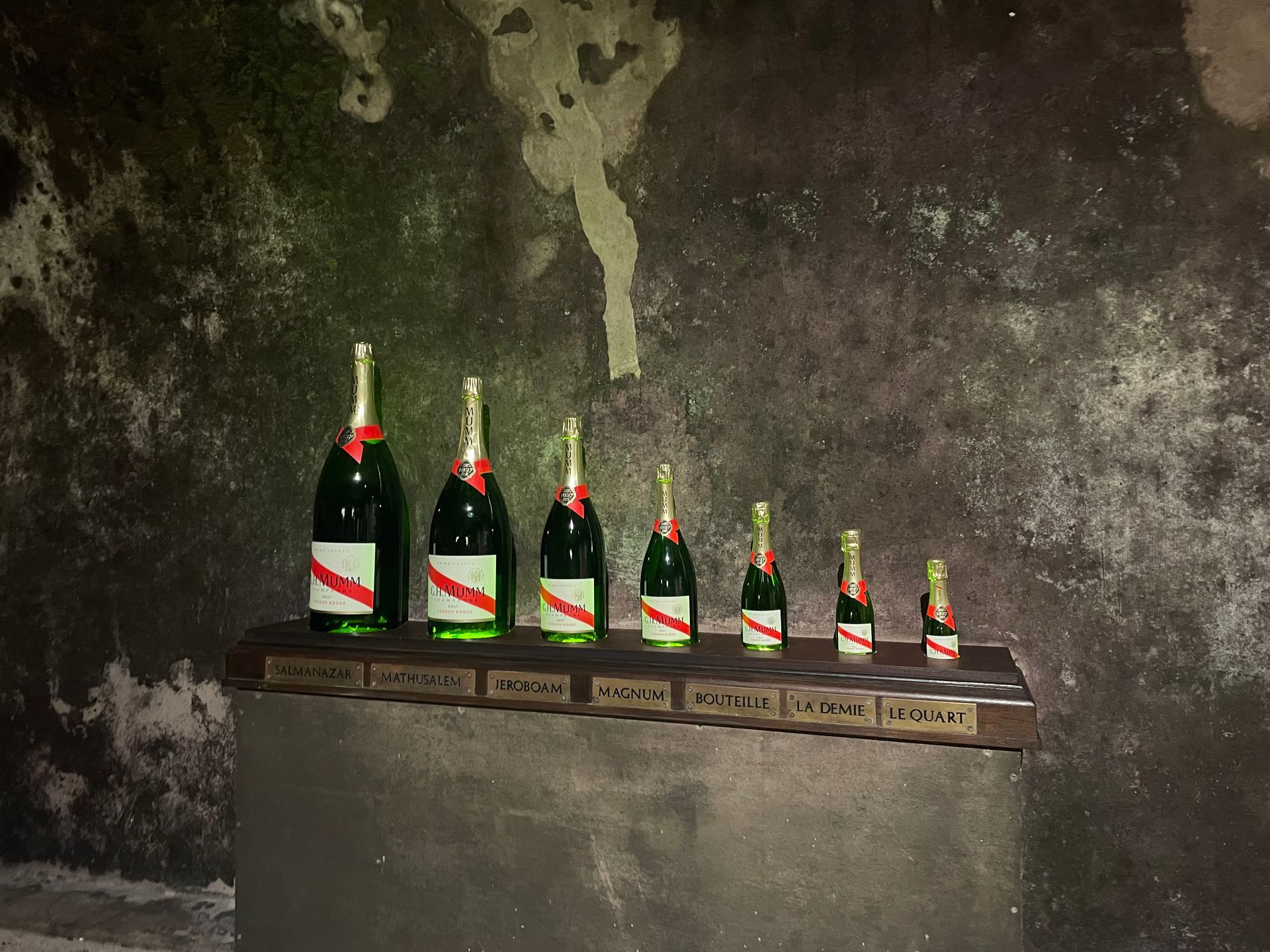 Various sizes of Mumm bottles of Champagne