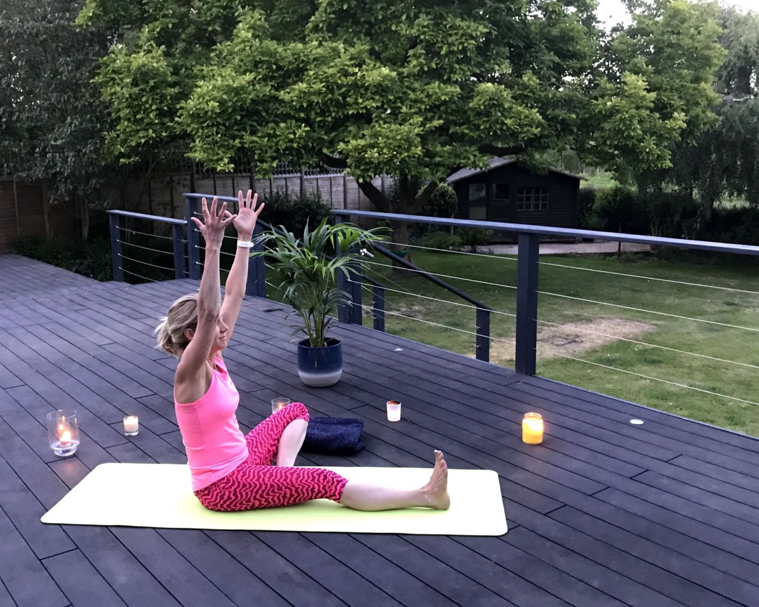 Shannon teaching yoga outside at the Cookham yoga studio