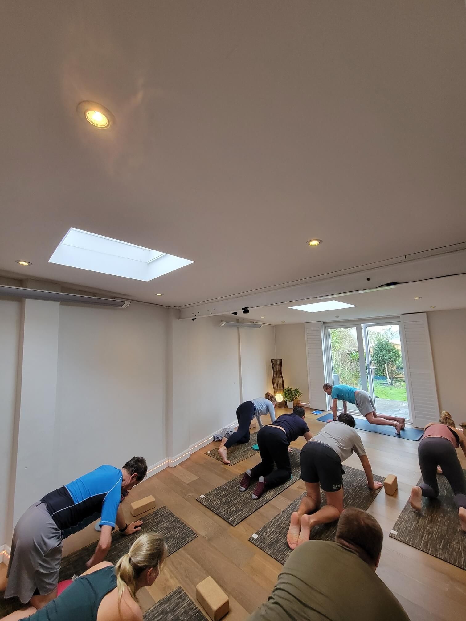 Vinyasa flow yoga in our studio gets the Wellbeing Reset day started