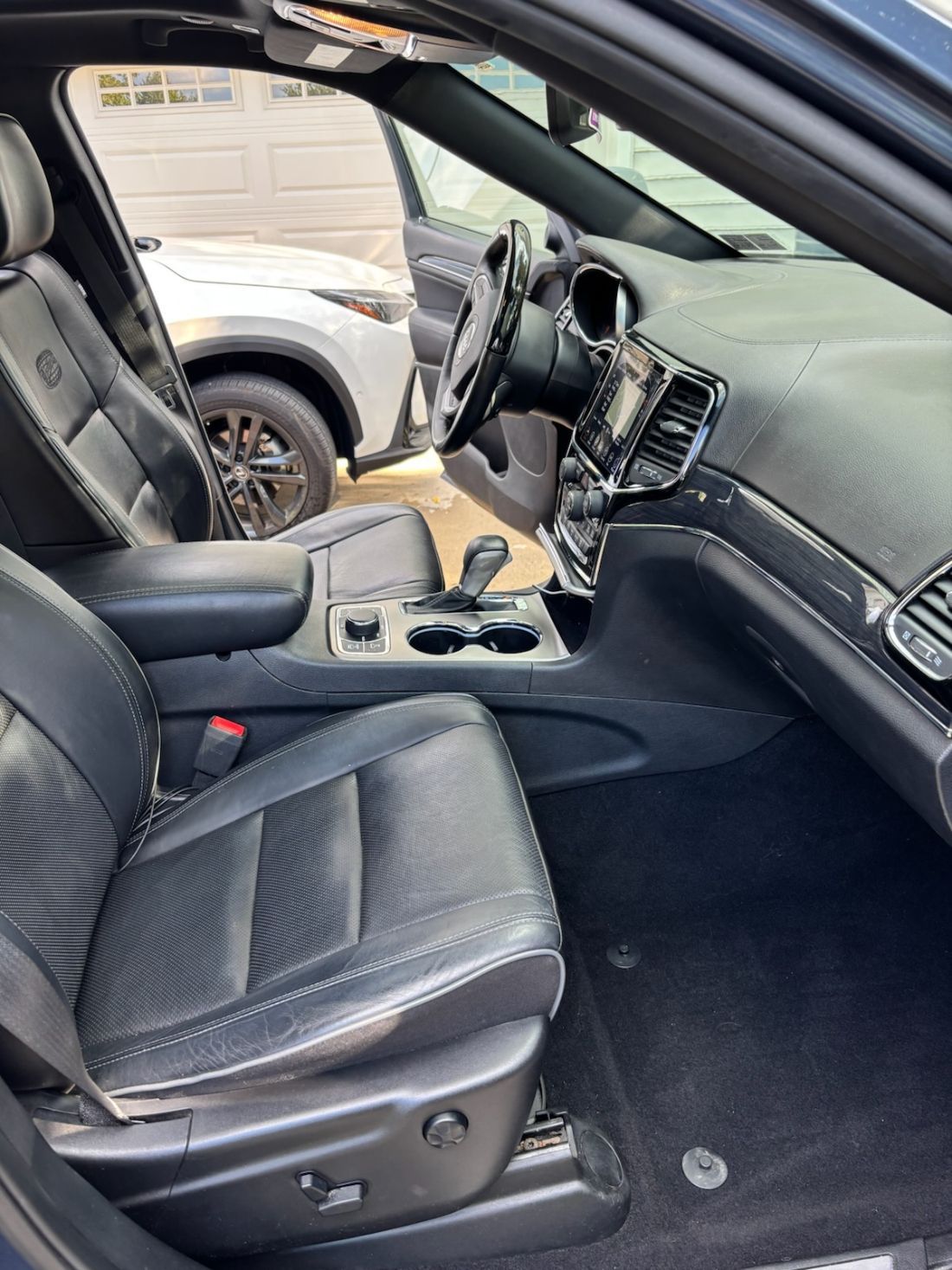 After slider of a Tesla interior professionally detailed by Gold Standard Mobile Detailing in Bala Cynwyd.