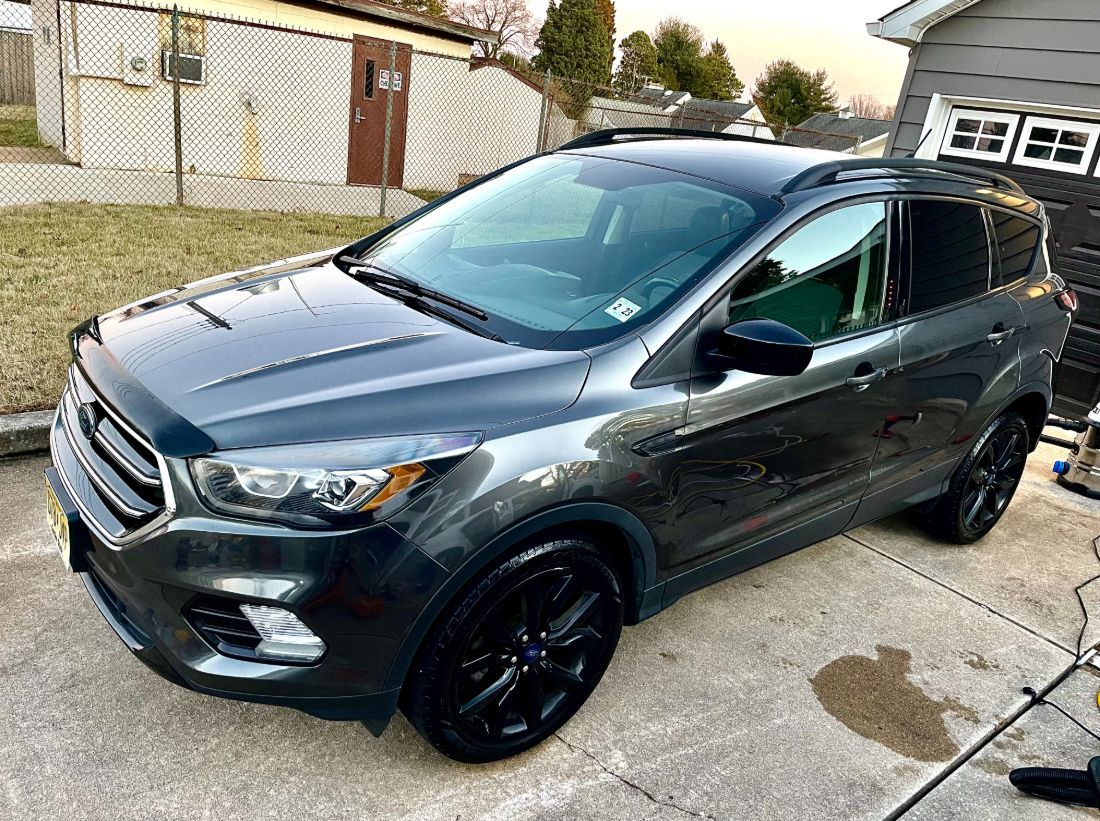 After slider of a luxury SUV with professional ceramic coating and paint correction by Gold Standard.